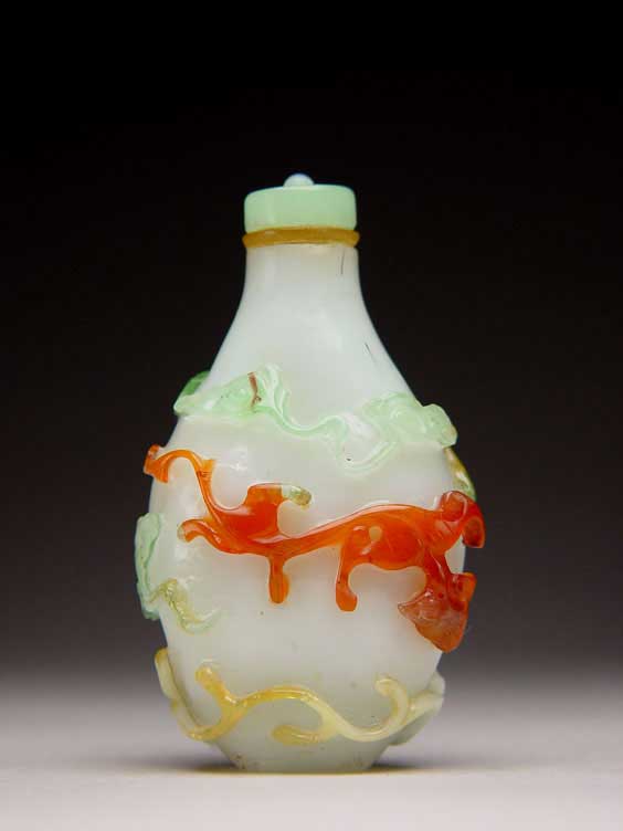 Appraisal: MULTI-COLOR OVERLAY SNUFF BOTTLE Well carved antique multi-color overlay glass