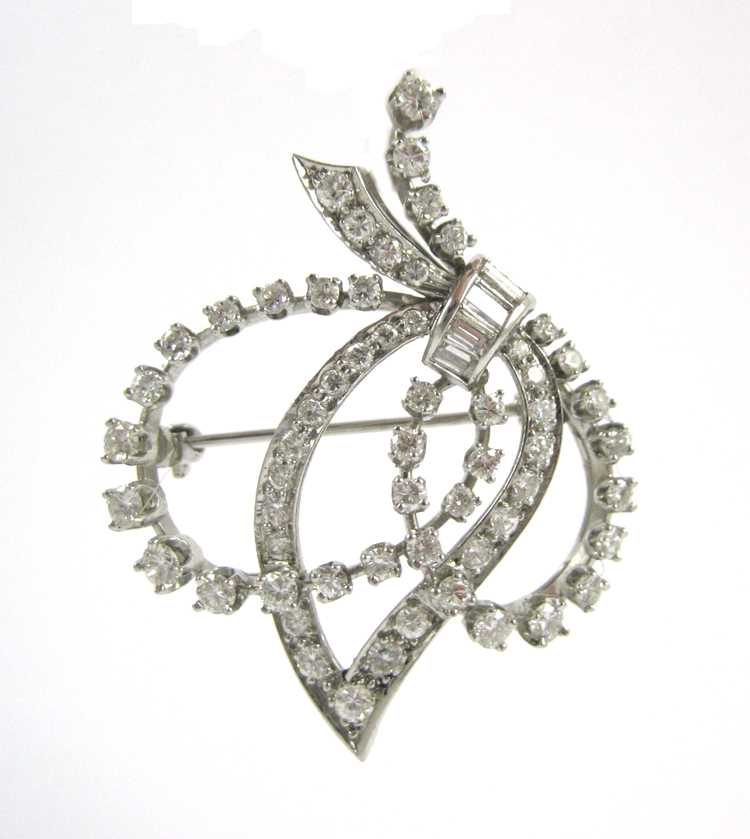 Appraisal: ESTATE DIAMOND AND PLATINUM BROOCH set with round-cut and four