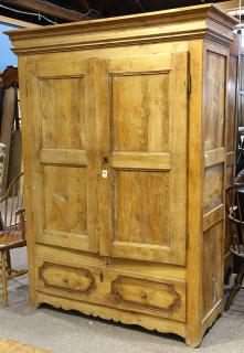 Appraisal: French carved pine linen press circa having two doors opening