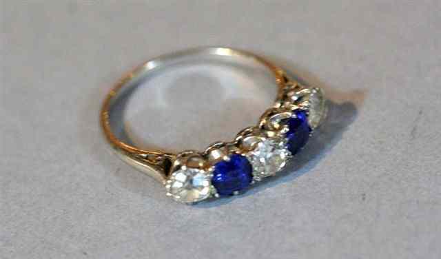 Appraisal: A FIVE STONE SAPPHIRE AND DIAMOND DRESS RING two cushion