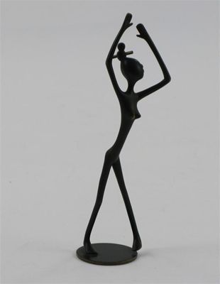 Appraisal: A Hagenauer patinated bronze figure of an African dancing figure