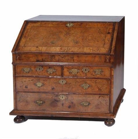 Appraisal: AN TH CENTURY WALNUT BUREAU the interior fitted pigeon holes