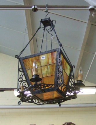 Appraisal: A wrought iron four branch lantern with mottled orange glass