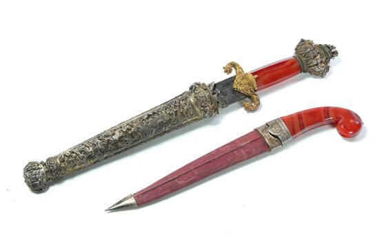 Appraisal: TWO DAGGERS Nineteenth or th century Both have similar red