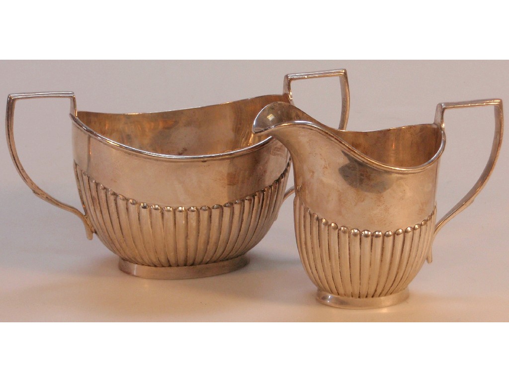 Appraisal: A George V silver two-handled sugar bowl with semi lobed