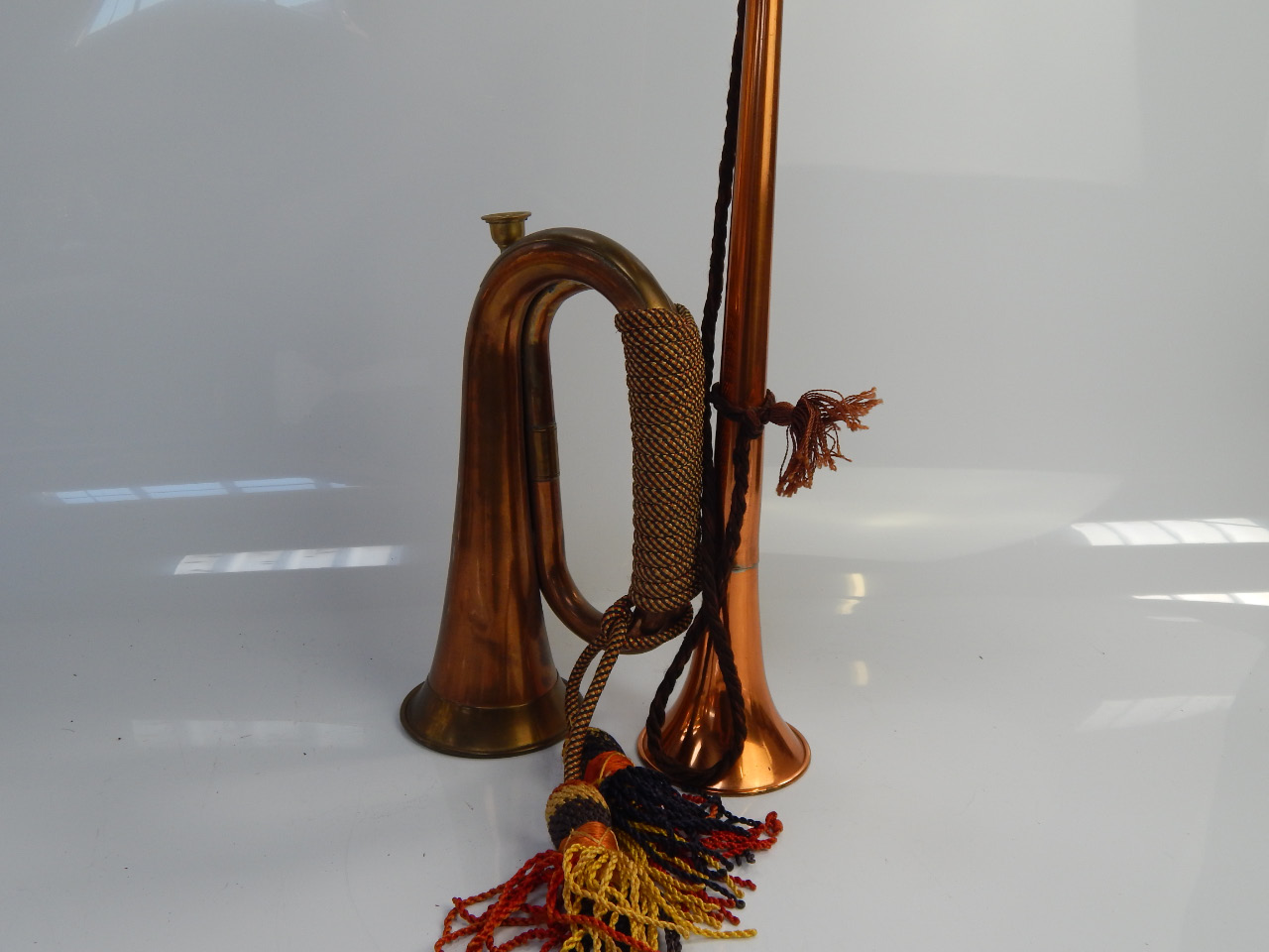 Appraisal: A copper and brass hunting horn with a copper and