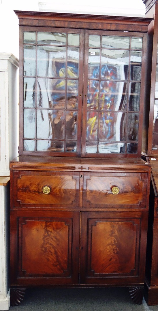 Appraisal: An early th century mahogany secretaire bookcase cabinet the pair