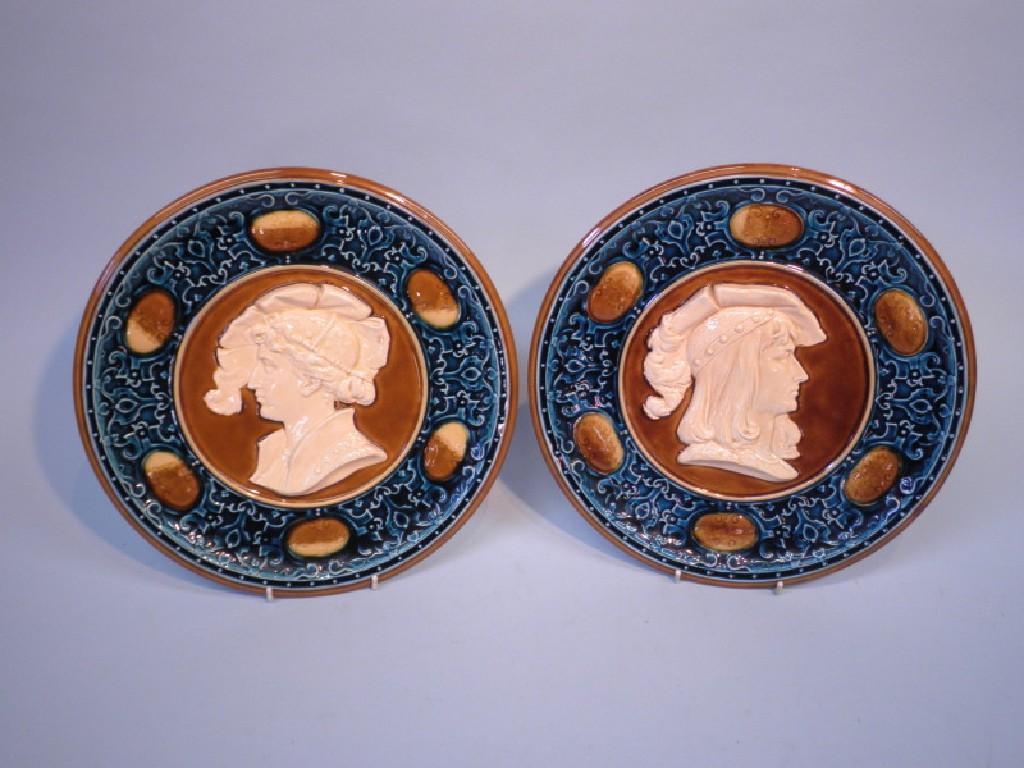 Appraisal: A pair of Austrian pottery wall plaques each in the