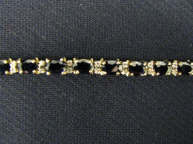 Appraisal: Sapphire Diamond Bracelet deep blue oval gems totaling carats with