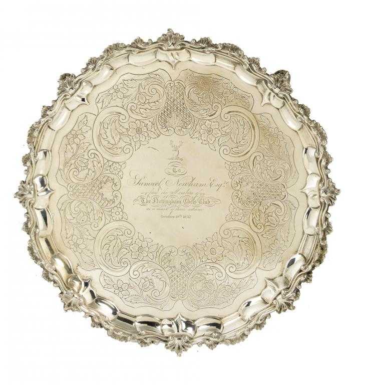 Appraisal: A GEORGE III SALVER flat chased c with a band