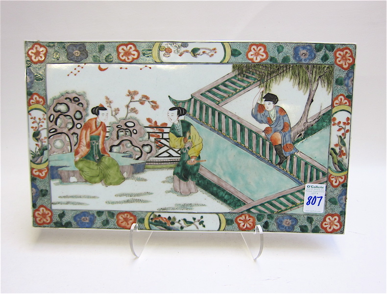 Appraisal: CHINESE FAMILLE VERTE PORCELAIN PLAQUE an allegorical courtyard enamel painting