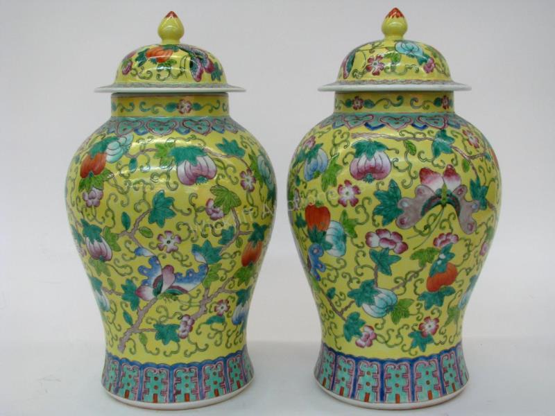 Appraisal: A pair of lidded porcelain Oriental ginger jars yellow ground