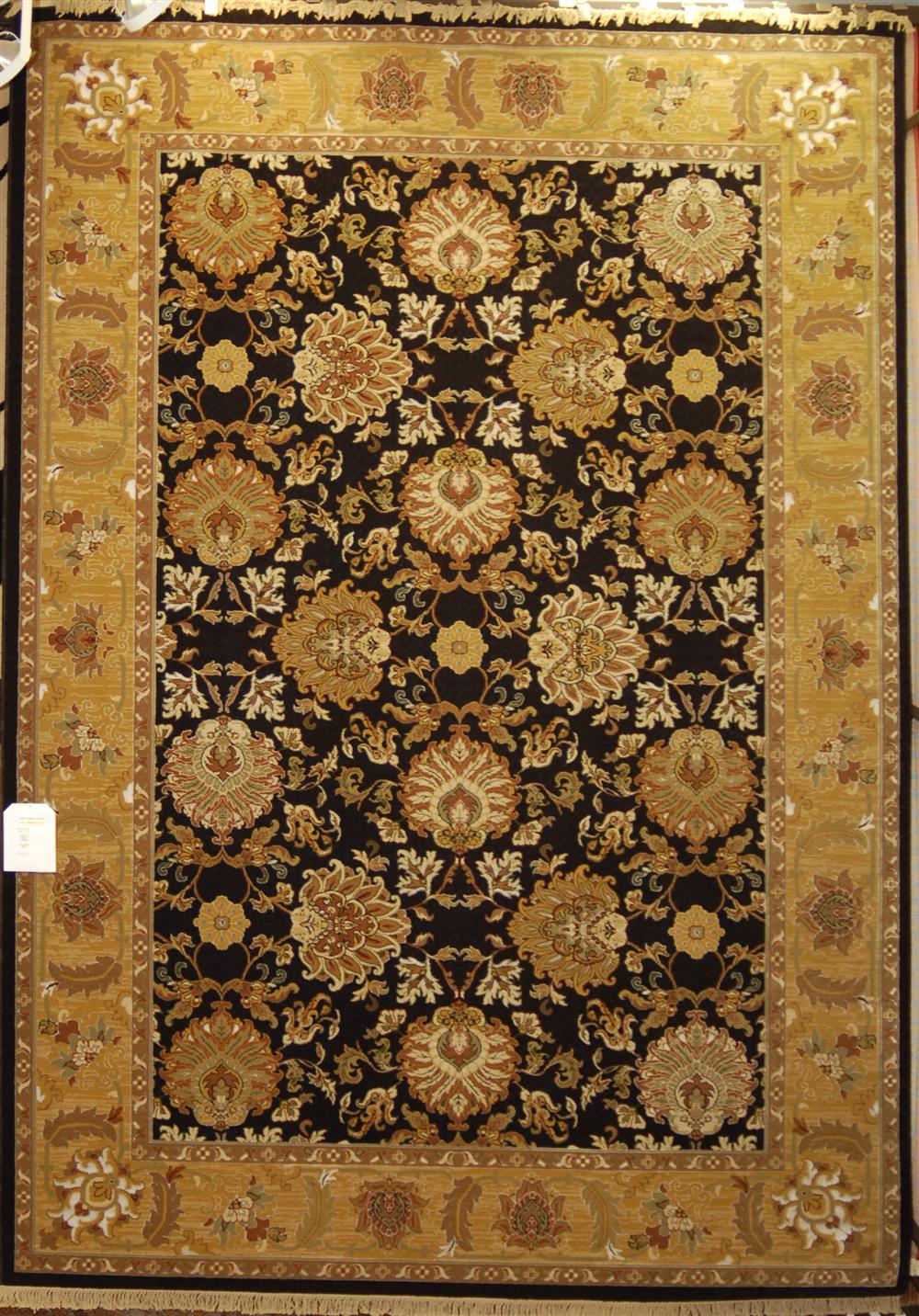 Appraisal: TRADITIONAL BLACK ORIENTAL RUG with gold ivory tan green and