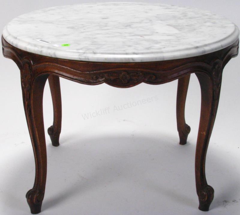 Appraisal: A French style end table with white beveled edge marble