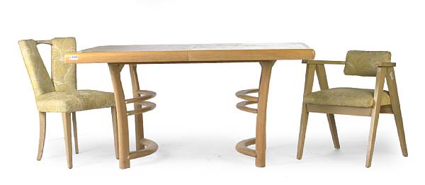 Appraisal: A mid-century modern dining suite comprising a dining table with