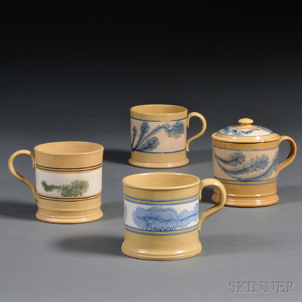 Appraisal: Four Yellowware Pint Mugs with Seaweed Mocha Decoration North America