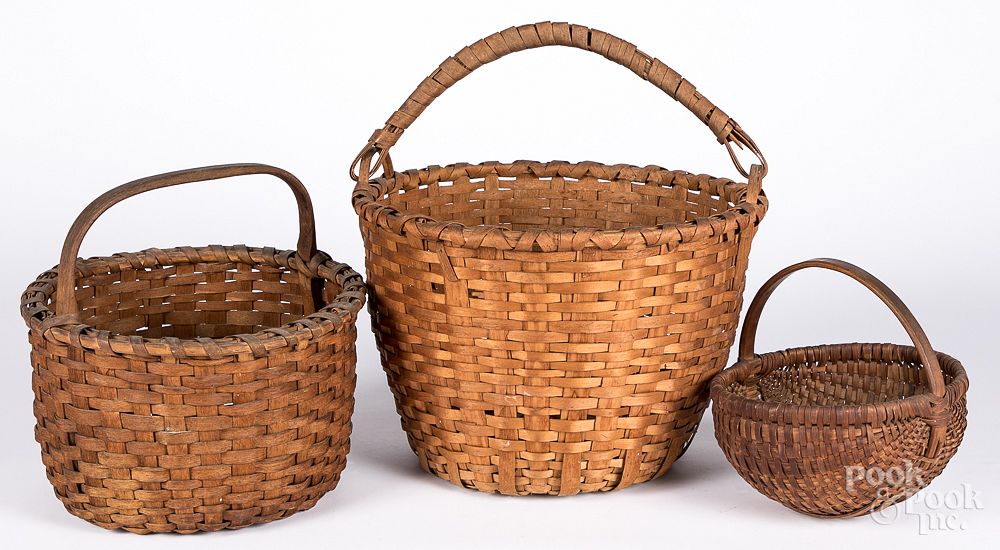 Appraisal: Three splint baskets Three splint baskets the largest with woven