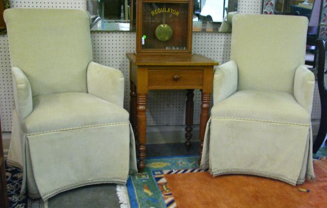 Appraisal: Pair of contemporary upholstered arm chairs with full pleated skirt