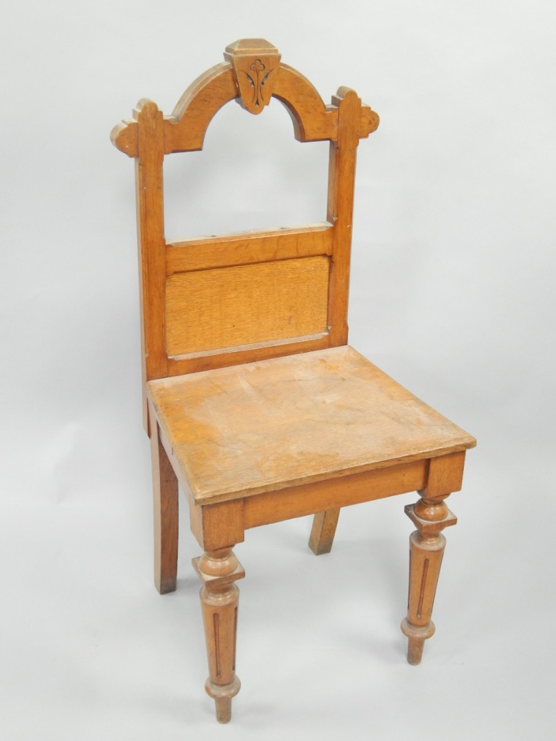 Appraisal: A Victorian gothic oak hall chair on turned and fluted