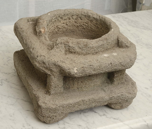 Appraisal: AN ANTIQUE CARVED STONE MORTAR the central cylinder within a