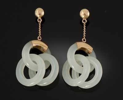 Appraisal: A Pair of Carved Jade Earrings White jade pendants in