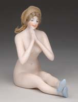 Appraisal: GERMAN BISQUE NUDE FIGURINE Woman with painted blue slippers and