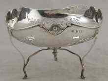 Appraisal: A pierced silver bowl on three legs with shell and