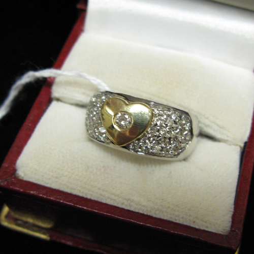 Appraisal: DIAMOND FOURTEEN KARAT WHITE AND YELLOW GOLD RING The white