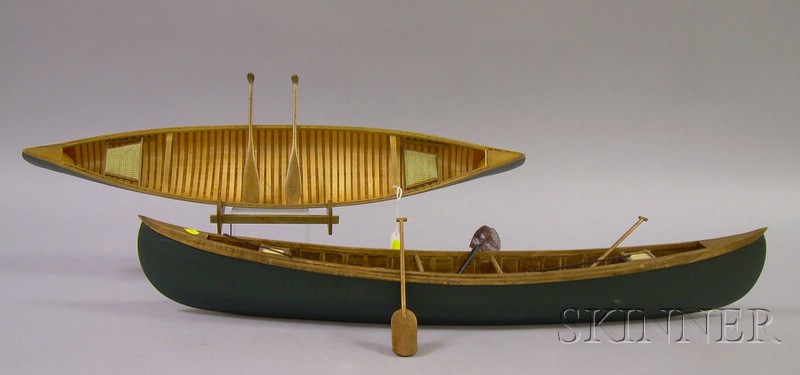 Appraisal: Two Painted Wooden Canoe Models late th century with accessories