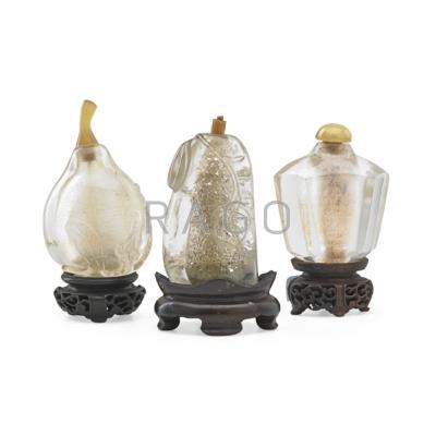 Appraisal: CHINESE ROCK CRYSTAL SNUFF BOTTLES Three with lids and bases