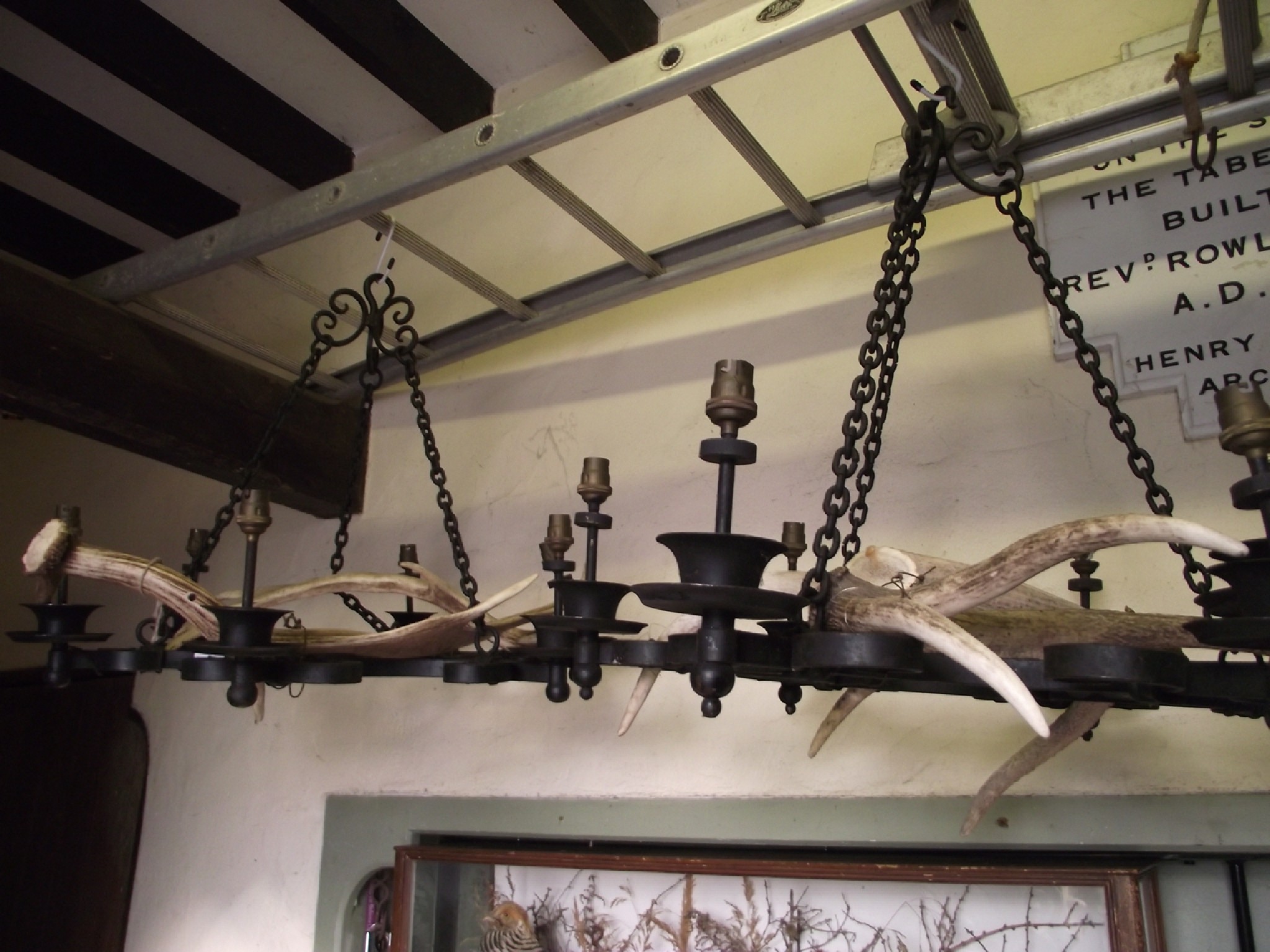 Appraisal: A pair of baronial style iron work hanging electroliers ceiling