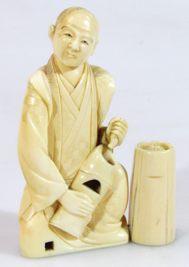 Appraisal: A thC Japanese ivory figure of a gentleman in flowing