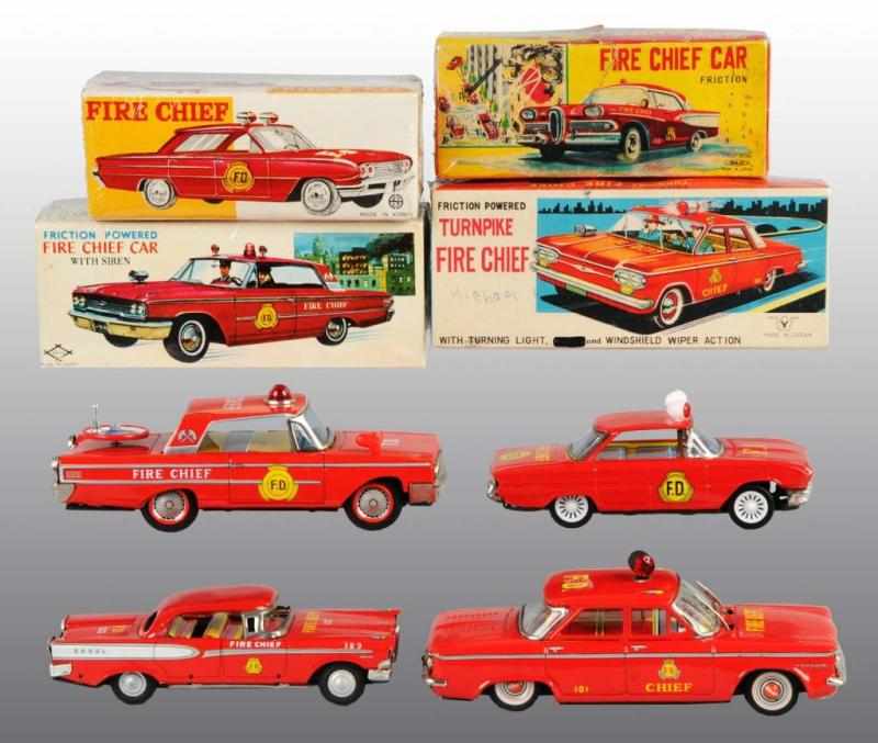 Appraisal: Lot of Tin Fire Chief Car Friction Toys Description Working