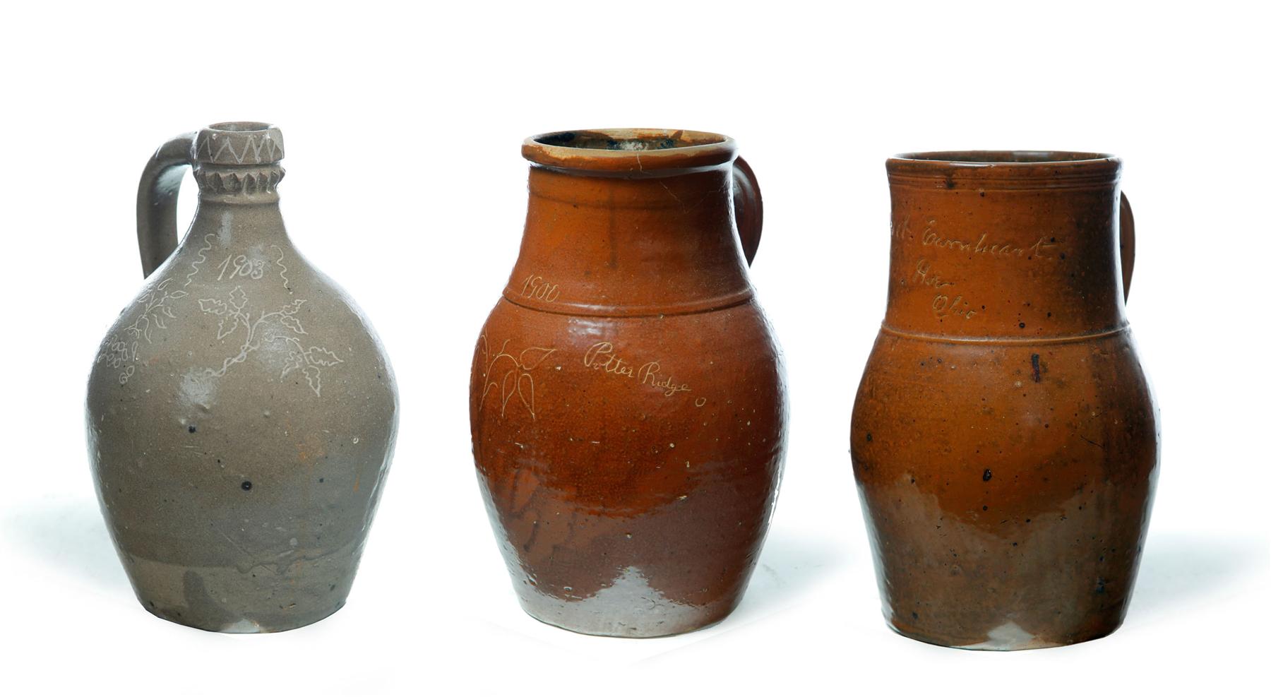 Appraisal: THREE INCISED STONEWARE JUGS Ohio late th-early th century Includes