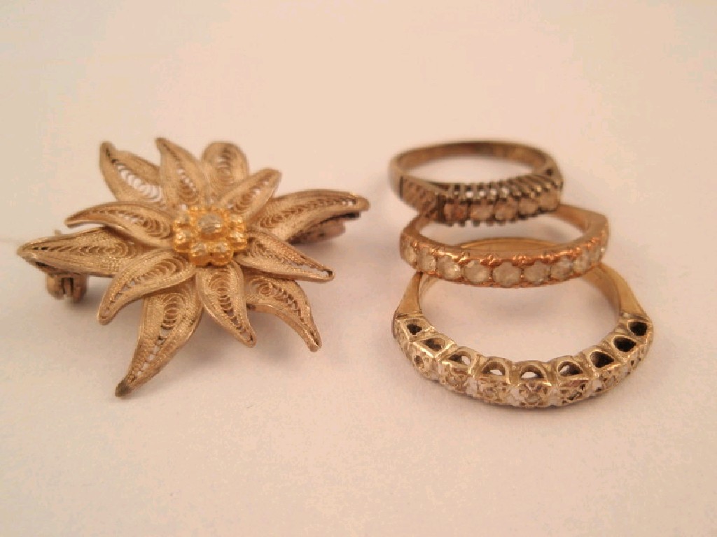 Appraisal: Three stone set rings and an Edelweiss brooch