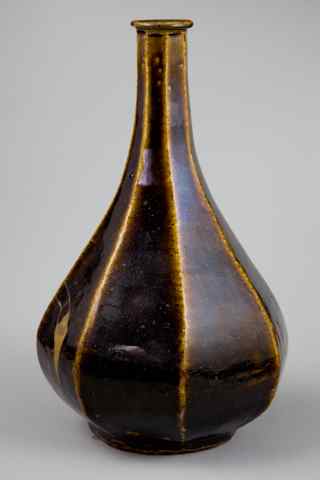 Appraisal: KOREAN IRON BROWN-GLAZED FACETED BOTTLE VASE of teardrop form with