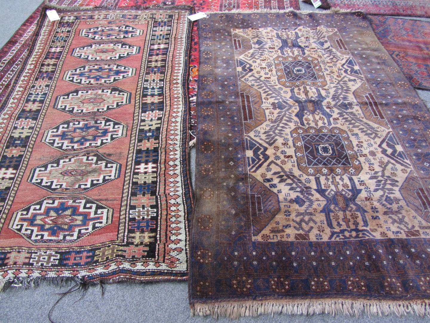 Appraisal: A Gendje rug Caucasian the plain madder field with seven