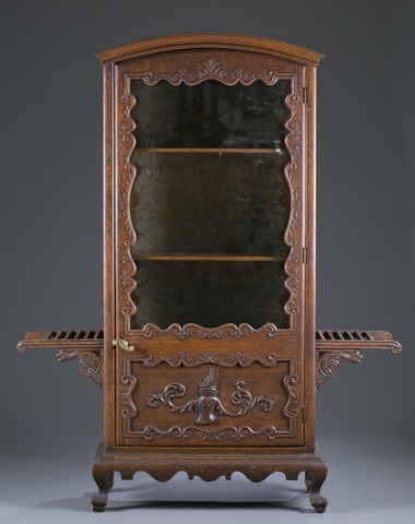 Appraisal: Golden Oak Curio Cabinet Carved and applied Japan-esque and heraldic