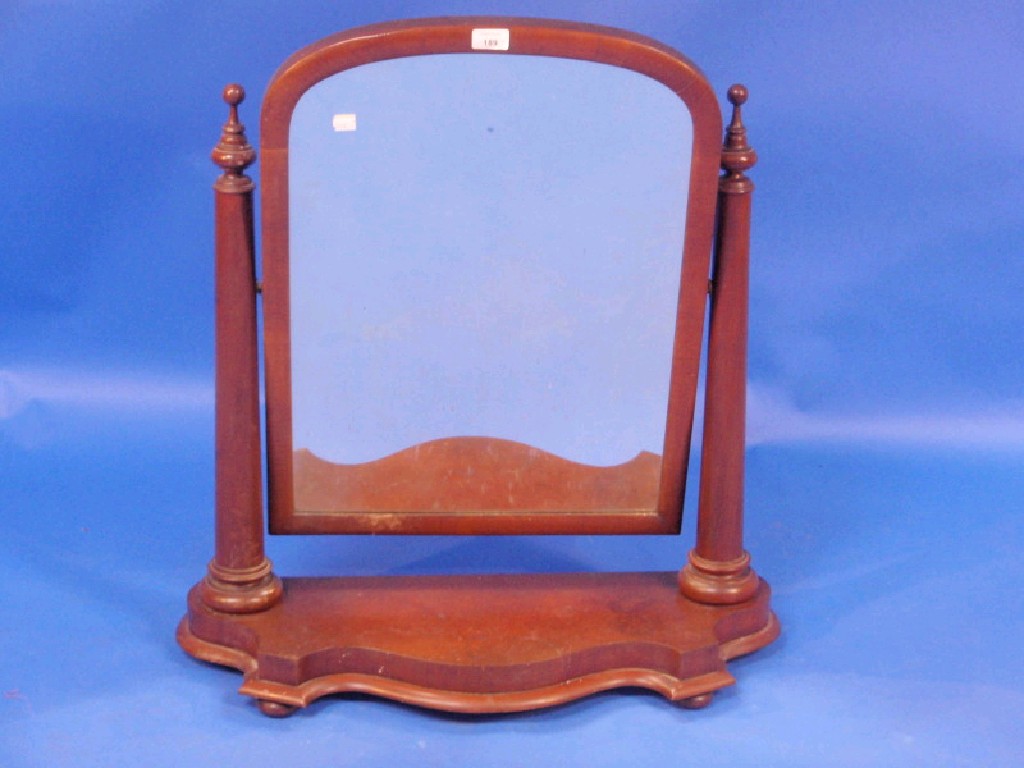 Appraisal: A large Victorian mahogany framed toilet mirror with arched cushion