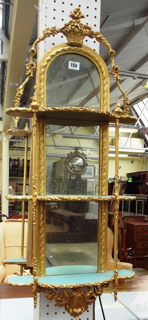 Appraisal: A pair of th century gilt framed open three tier