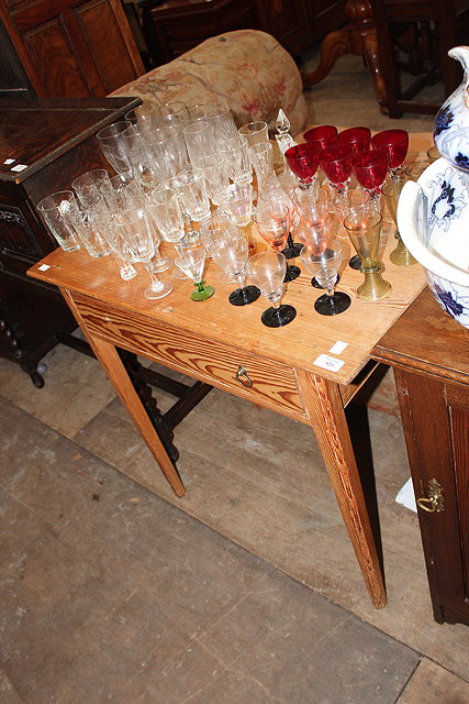 Appraisal: AN ANTIQUE STRIPPED PINE SIDE TABLE with single frieze drawer