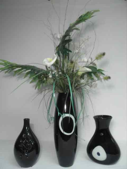 Appraisal: Lot of two black art vases and a silk floral