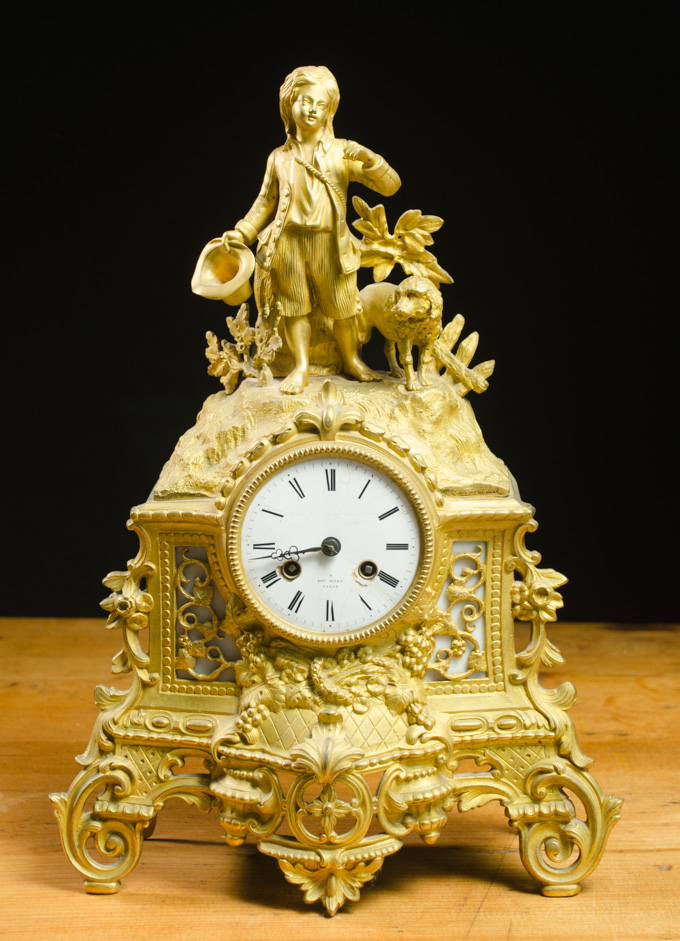 Appraisal: FRENCH FIGURAL GILT-BRONZE MANTEL CLOCK Henry Marc clockmaker Paris th