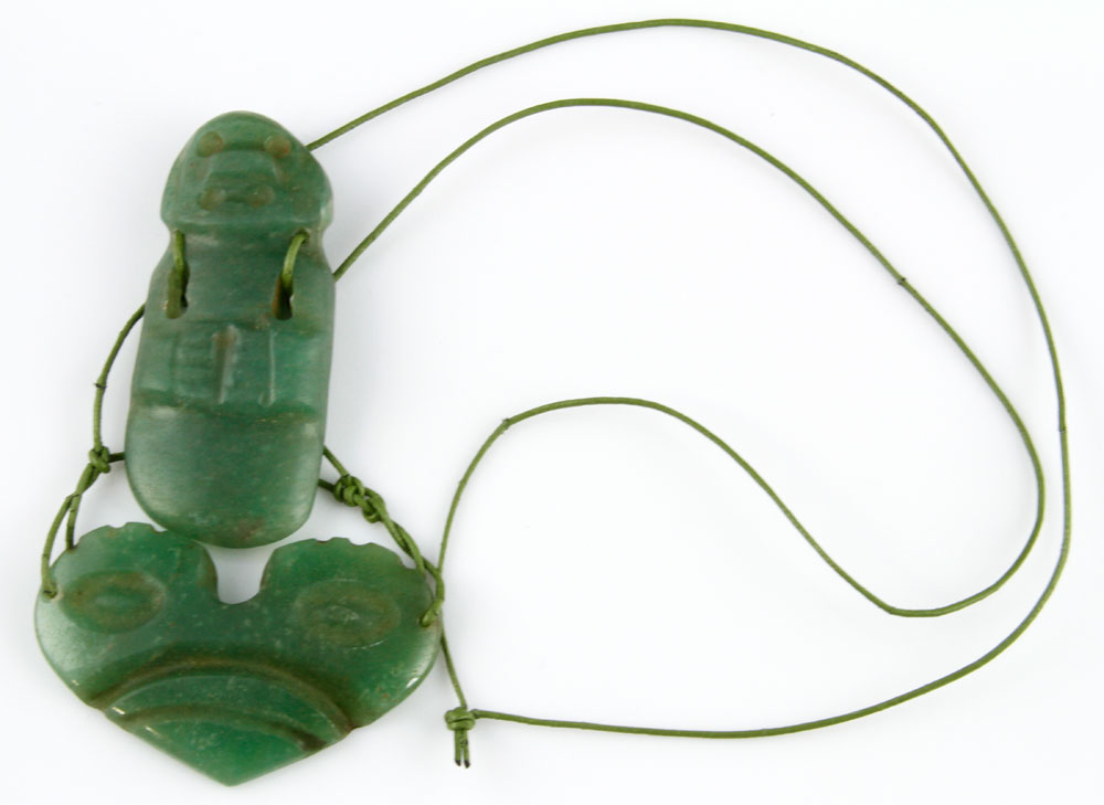 Appraisal: - Pieces of Jade Two pieces of jade antiquity worn