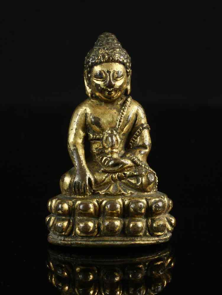 Appraisal: EARLY MINIATURE BUDDHA - Gilt Bronze Chinese Buddha seated on