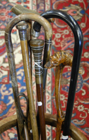 Appraisal: A bundle of walking sticks and canes two with silver