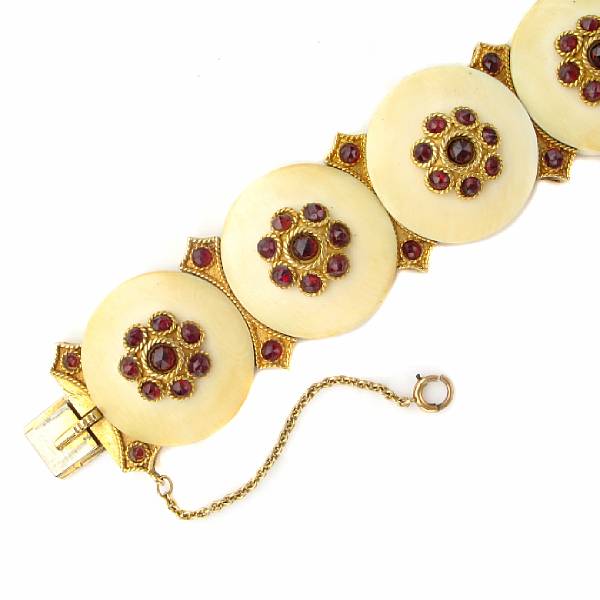 Appraisal: An ivory garnet and fourteen karat gold bracelet Length in