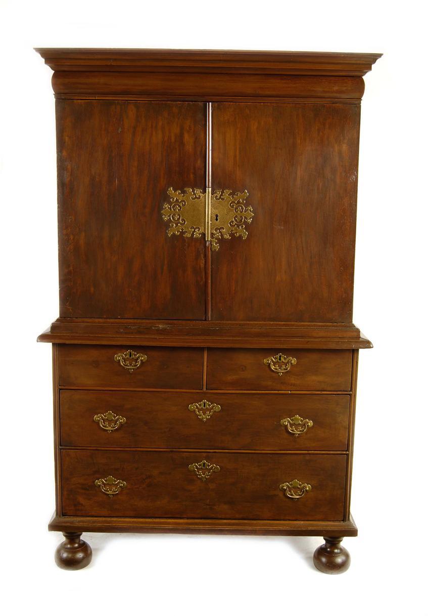 Appraisal: A fruitwood cabinet on chest