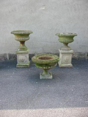 Appraisal: A MATCHED PAIR OF COMPOSITION STONE URNS of lobed campana