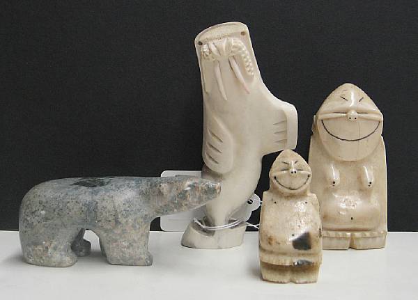 Appraisal: Four Eskimo carvings Including two ivory Billiken an antler figure